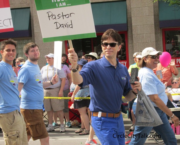 Pastor David from Life Journey Church walks the parade route with members of his LGBT friendly congregation.  